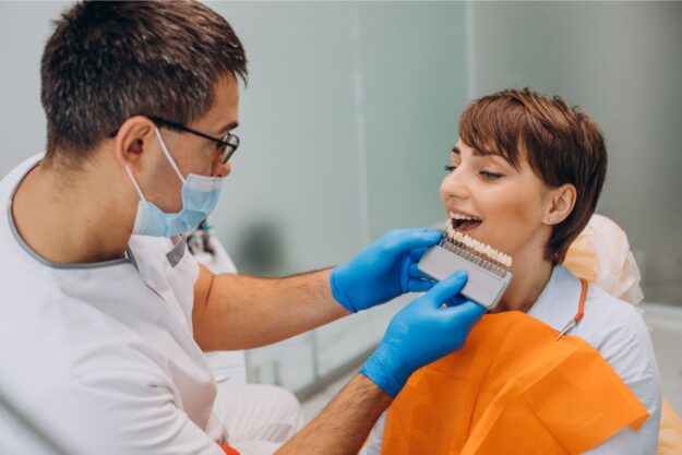 Dentist examining veneers for decay, emphasizing cavity prevention tips.