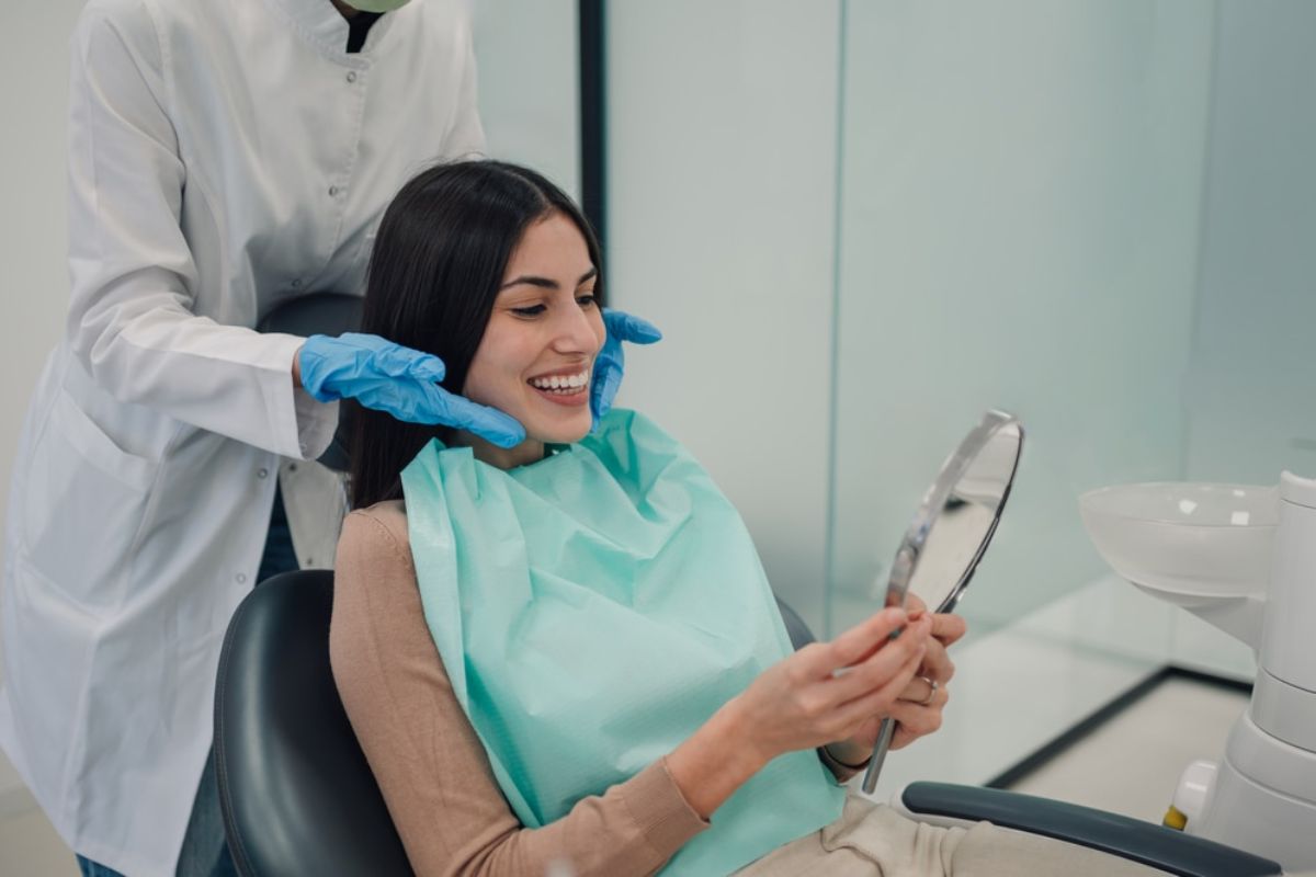 A happy and confident person smiling A happy, confident person smiling after orthodontic treatment.