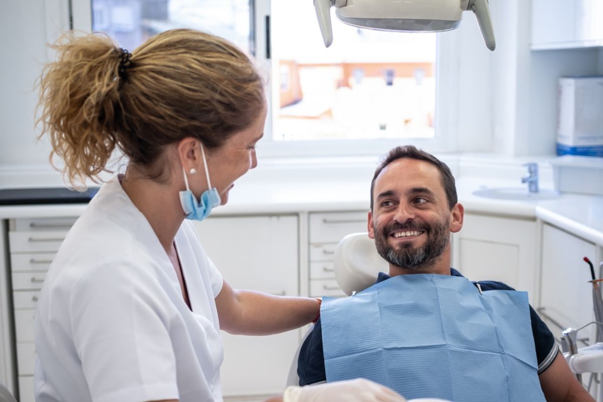 Smiling patient after successful dental implant Smiling patient after successful dental implant recovery.