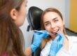 Smiling patient receiving gum care.