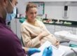 Pregnant woman smiling during a dental checkup.