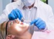 Patient receiving orthodontic dental examination to improve oral health and alignment.
